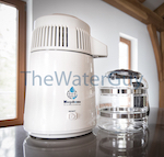 Countertop Water Distiller in White on White with glass carafe by Megahome Model # MH943TWS+GB+PI